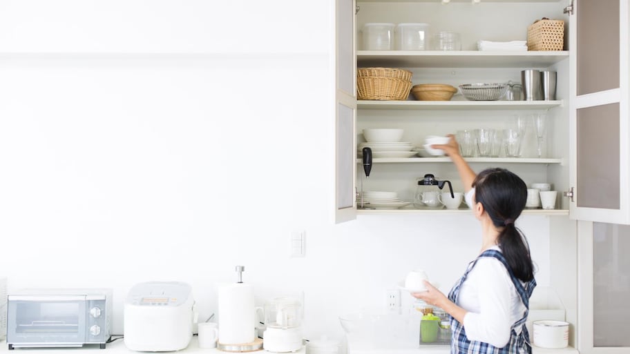 Woman organizing kitchen