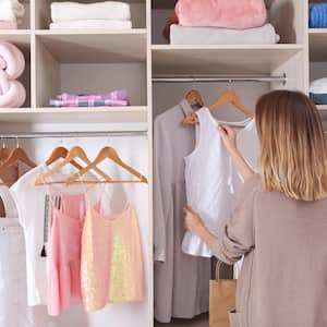 A woman browsing her closet for an outfit 
