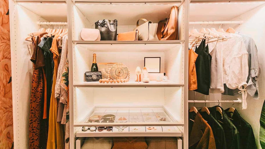 Shelves of a closet with a line of bulbs