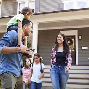 A family outside their home