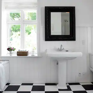 bright white bathroom with classic pedestal sink