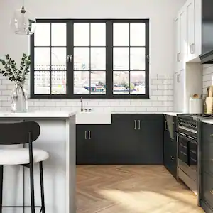 A modern kitchen with black and white cabinets