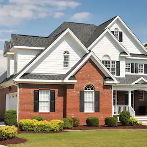 The exterior of a house with a landscaped lawn