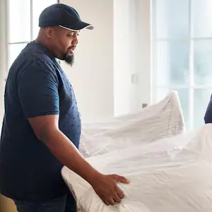 Movers moving a sofa 