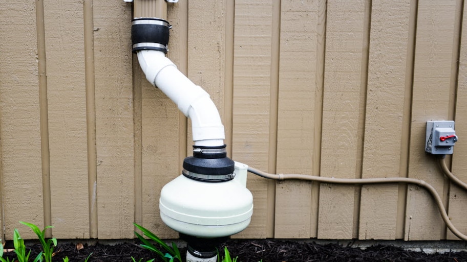 radon tester attached to a gutter downspout. 