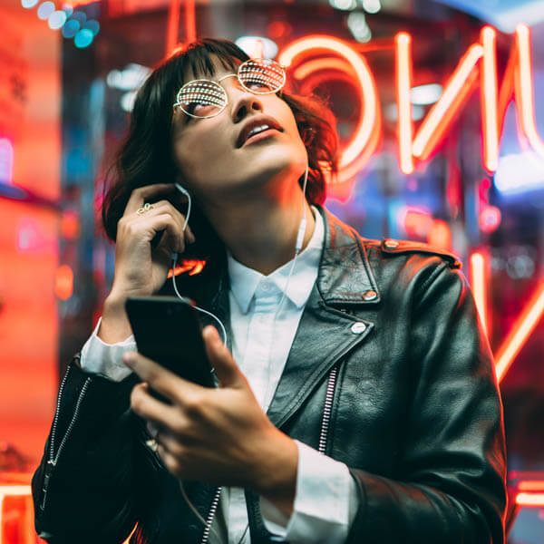 Woman looking at neon lights
