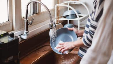 A woman cleaning dishes