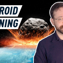 Text reading "asteroid warning" with host standing in front of asteroid 