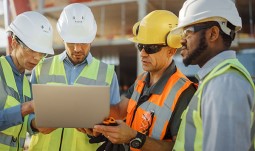 Construction workers surveying the worksite