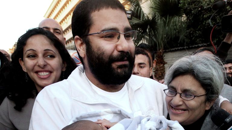 Egyptian pro-democracy activist Alaa Abd El-Fattah meets his recently born son, Khaled, for the first time after being released from prison in December 2011. Credit: Associated Press