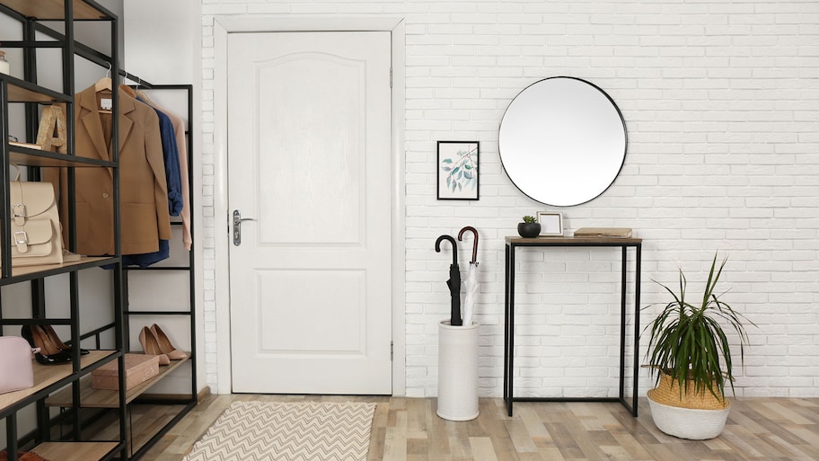 The entryway of a house with a minimalistic console table