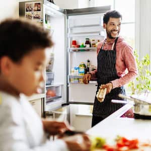 A dad preparing lunch for his son