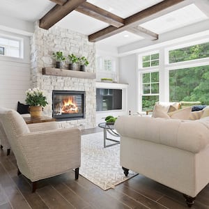 Family room with fireplace with stone surround