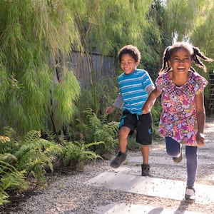 children running and playing in garden