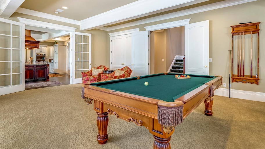 Light brown game room with billiard table