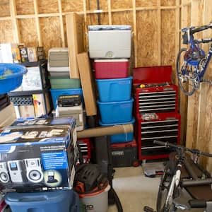 Garage filled with a bike, boxes and other items