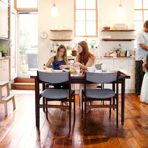 Family in kitchen with dark stained hardwood floors