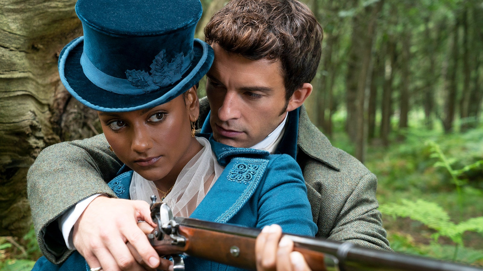 Simone Ashley as Kate Sharma Jonathan Bailey as Anthony Bridgerton aiming a gun in Bridgerton