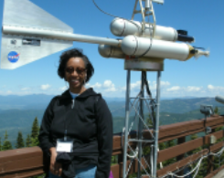 Woman with weather monitoring system