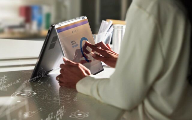 Woman using the APEX Console on a Dell Latitude 9430 2-in-1 laptop.