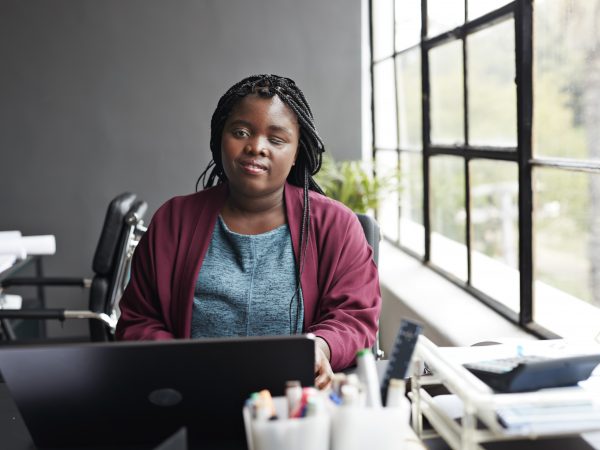 A woman sitting at her laptop computer