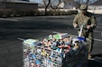 Boy Scouts and volunteers unload food at the Community Action Services and Food Bank in Orem, March 16, 2019 during Scouting for Food.