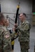 Command Sgt. Maj. Richard Brown, accepts the 97th Troop Command colors from Col. Tammy Manwaring during the change of command ceremony on Camp Williams, Utah, May 23, 2020. By accepting the colors, Brown symbolically took the reins of responsibility over the 97th Troop Command. (U.S. Army National Guard photo taken by Spc. Alejandro Lucero)