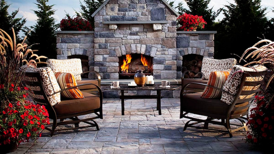 Earth-tone pavers patio and outdoor fireplace