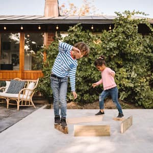 Siblings playing in the yard