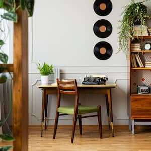 A home office with a vintage desk and a bookcase