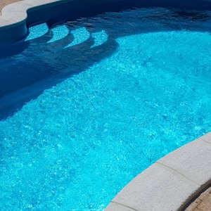 Overview of a swimming pool with a blue pool liner