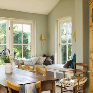 A grandfather clock in a dining room