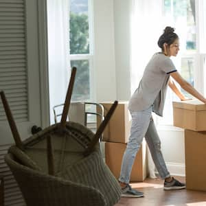 A young woman moving in a new house