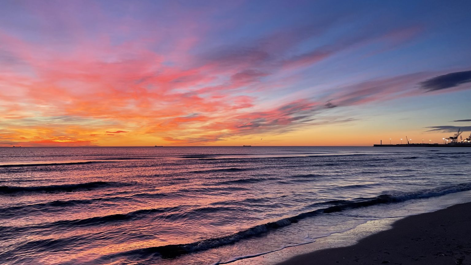 Colorful sunset beach with yellow, purple and orange color tone.