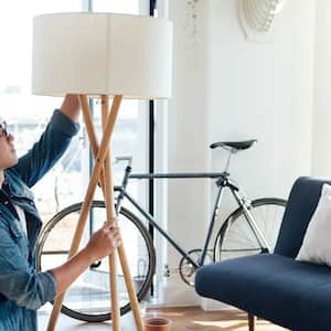 A man changing a light bulb