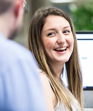 Female Informa colleague smiling 