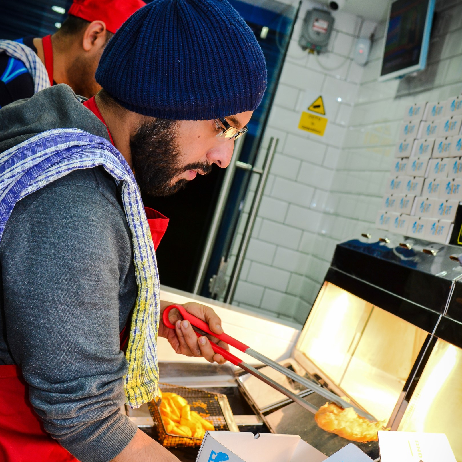 Tarv Nijjar working in restaurant