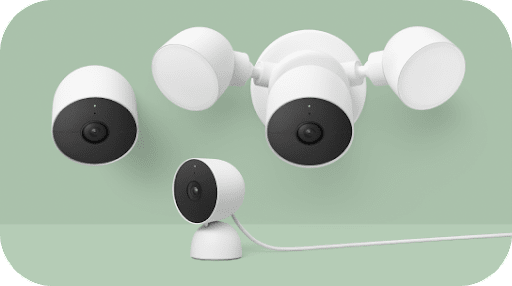 The family of Nest cameras arranged against a textured display.