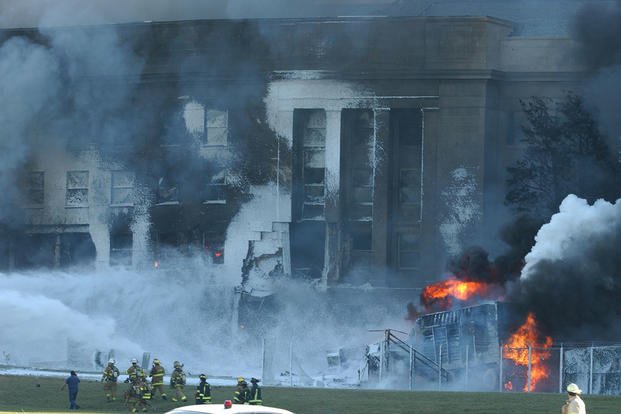 Fire crews work to put out the flames minutes after the attack on Sept. 11, 2001. 