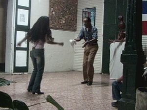 View dancers performing the “Baile de palo” an open-couple dance of African heritage