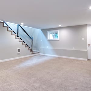 Light spacious basement area with staircase