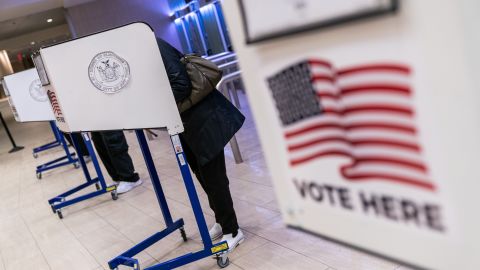 Voters cast ballots at an early voting polling location for the 2020 Presidential election at Madison Square Garden in New York, U.S., on Monday, Oct. 26, 2020. With eight days until the election, 59.4 million people have cast ballots in-person at early voting centers or by mail, according to the U.S. Elections Project. Photographer: Jeenah Moon/Bloomberg via Getty Images