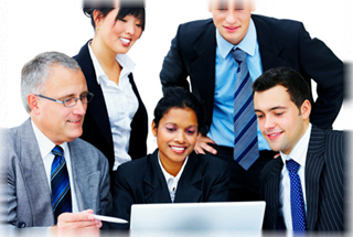 Office workers looking at computer