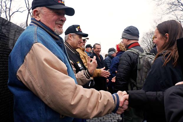 Former Soldier Gale “Caje” Shire (left) leads a receiving line of the “Currahee Brothers” at the Vietnam Veterans Memorial in Washington, D.C., Feb. 19, 2018. (U.S. Army/Staff Sgt. Paige Behringer)