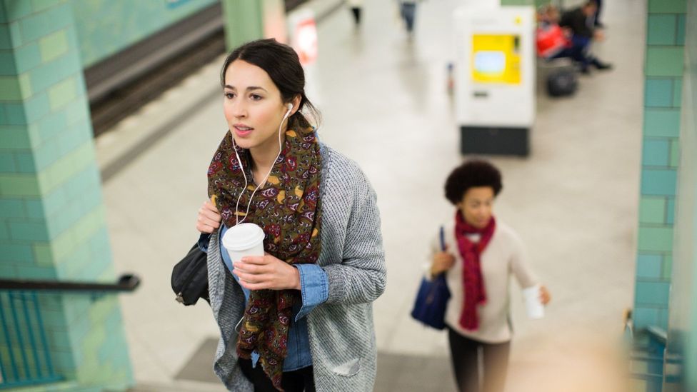 A woman exiting the subway