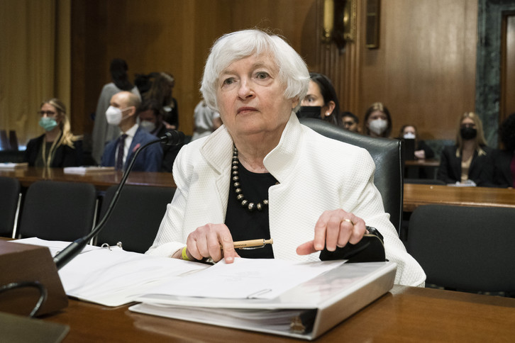 Treasury Secretary Janet Yellen prepares documents before the start of a Senate hearing.