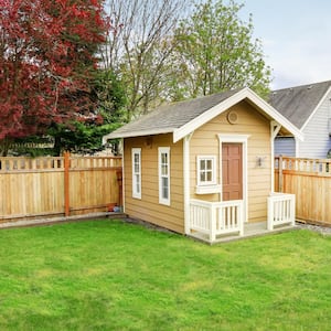 A small wooden shed in the backyard