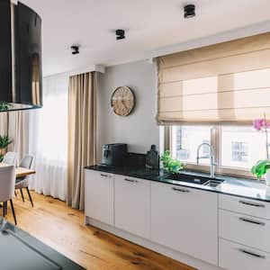 A kitchen with black quartzite countertop