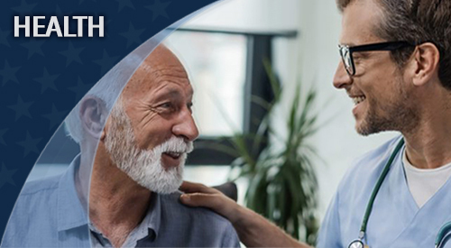 Health care worker speaking with male Veteran