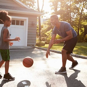 Father and son playing basketball